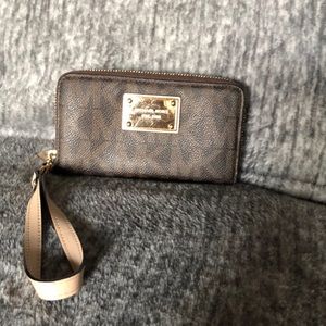 Michael Kors medium size wallet with a wristlet